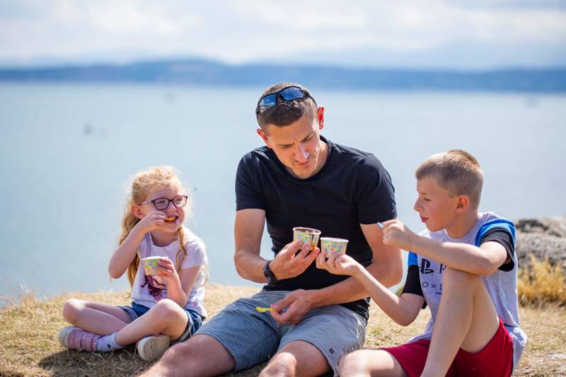 Family eating ice cream at the seaside